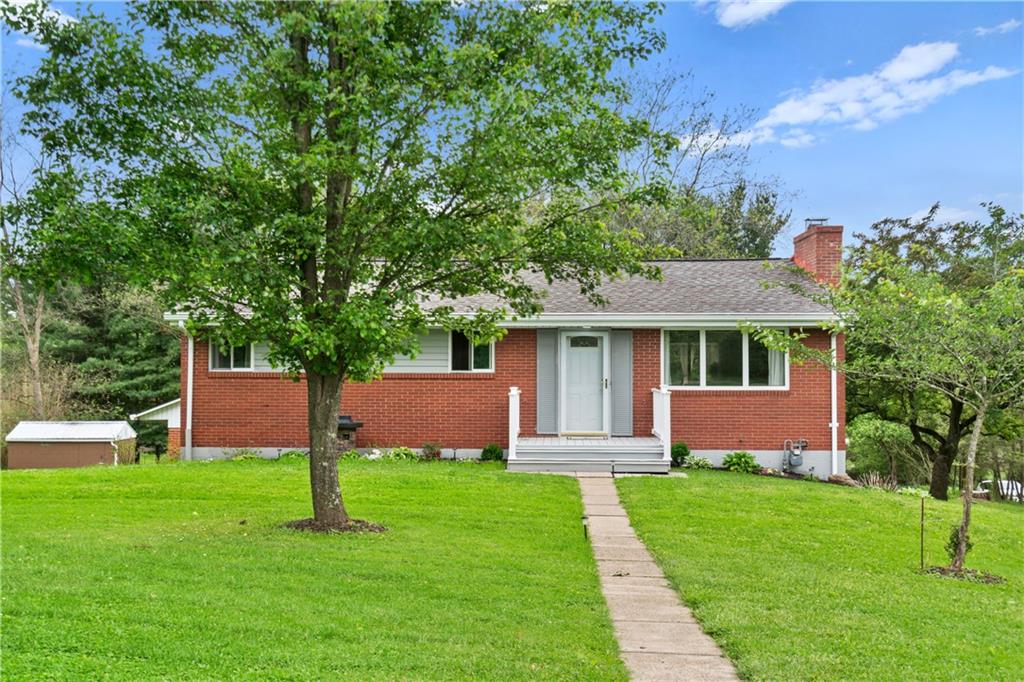 5431 Hamilton Road Gibsonia, PA 15044 - Photo 1 of 28 a front view of a house with garden and a tree