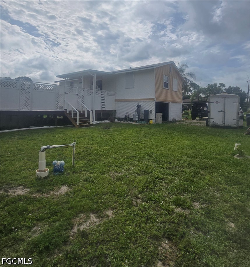 8093 Anhinga Road Fort Myers, FL 33967 - Photo 46 of 49 a view of a house with a backyard