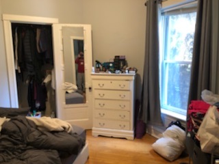 Undisclosed Address Chicago, IL 60613 - Photo 9 of 22 a bedroom with a bed and a window