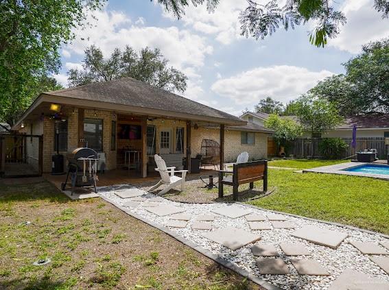3200 Hummingbird Avenue McAllen, TX 78504 - Photo 25 of 31 a view of a house with backyard sitting area and porch