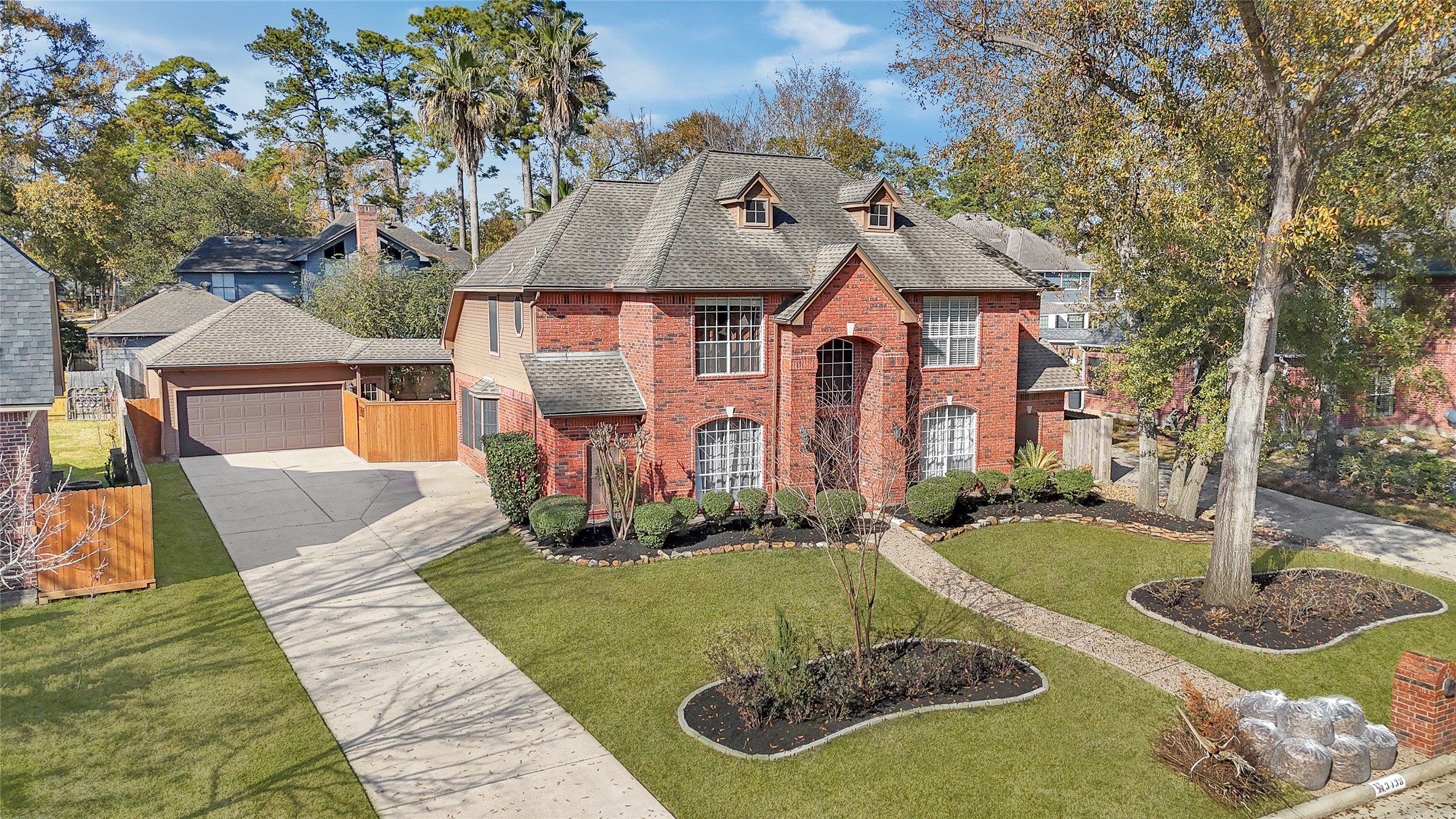 Long driveway access with detached garage.
