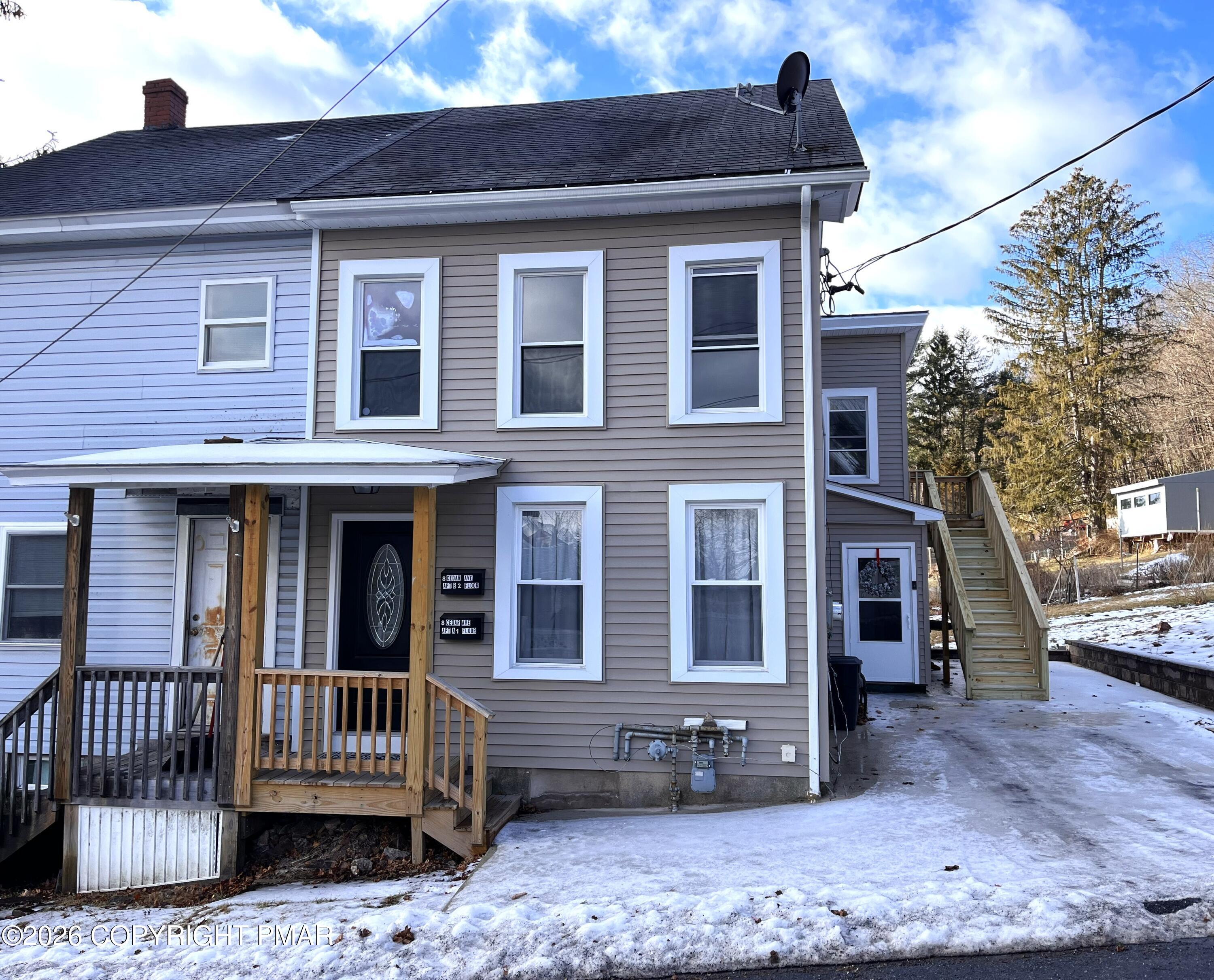 8 Cedar Avenue Jim Thorpe, PA 18229 - Photo 2 of 13 a front view of a house with a yard