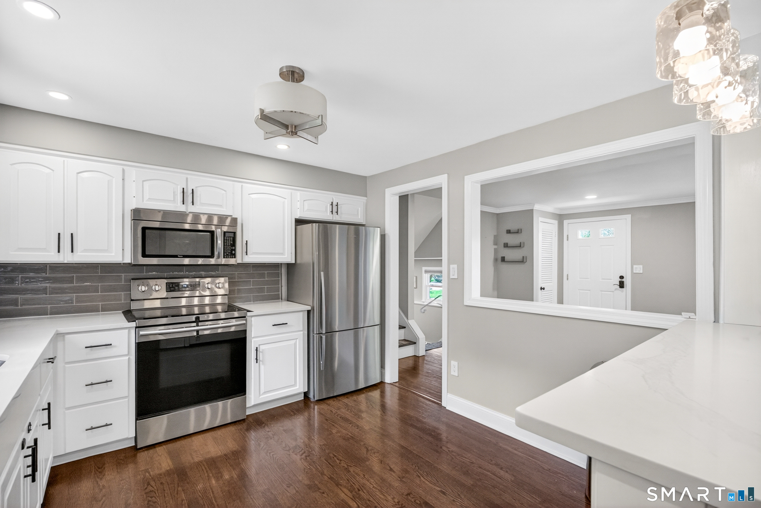 568 Wiese Road Cheshire, CT 06410 - Photo 13 of 40 a kitchen with stainless steel appliances a stove sink and refrigerator