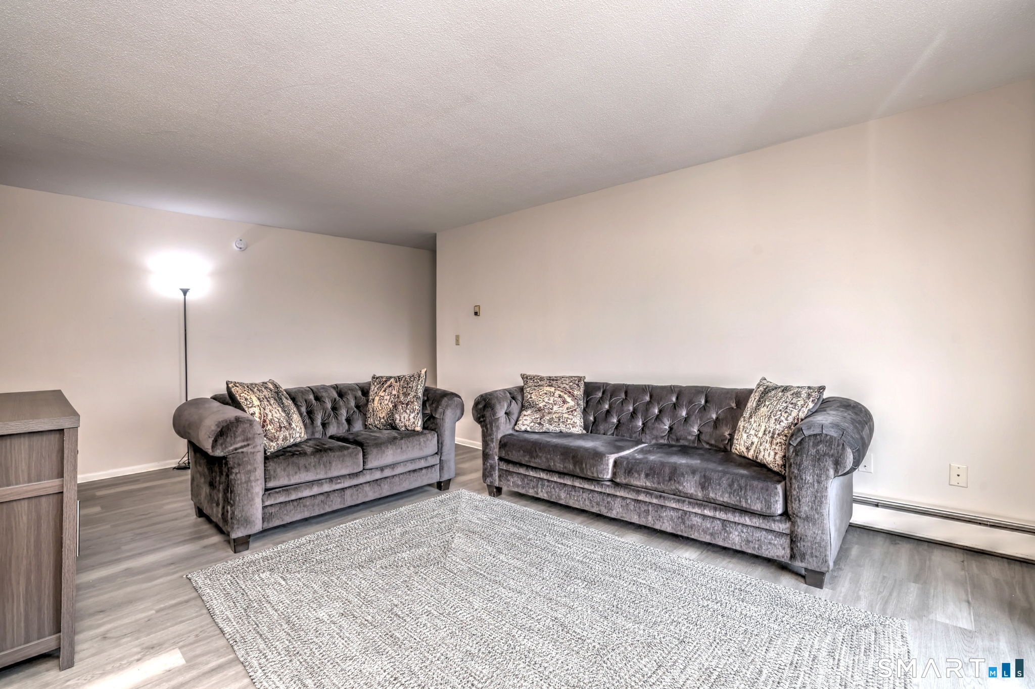 43 Balance Rock Road, Unit 11 Seymour, CT 06483 - Photo 18 of 40 a living room with couches and a night stand