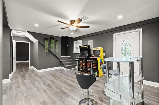 a dining room with furniture and wooden floor
