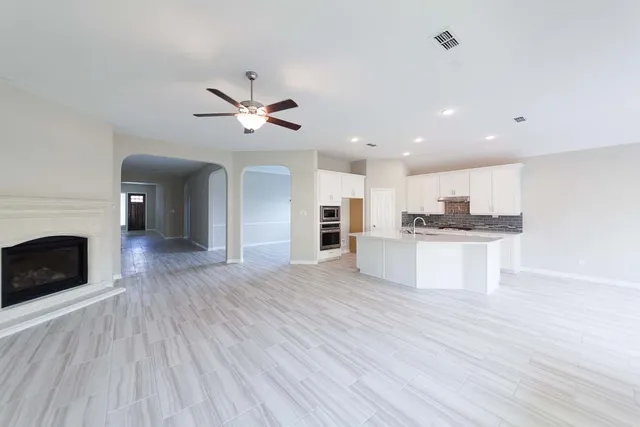 a view of kitchen with cabinets and wooden floor