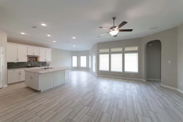 a view of kitchen with sink and wooden floor