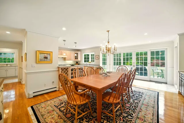 a view of a dining room with furniture wooden floor and a rug