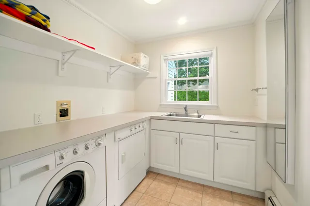 a bathroom with a granite countertop toilet sink and mirror
