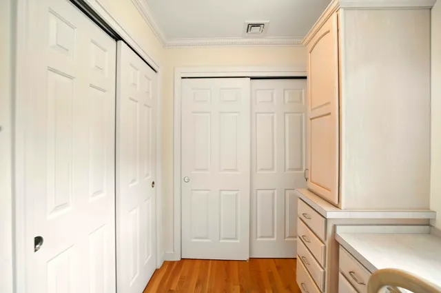 a bathroom with a tub a sink and mirror