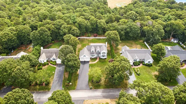 an aerial view of a house with yard swimming pool and outdoor seating