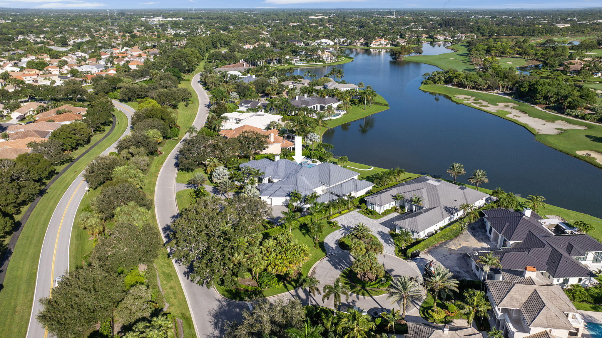 208 Locha Drive Jupiter, FL 33458 - Photo 106 of 125 an aerial view of residential houses with outdoor space