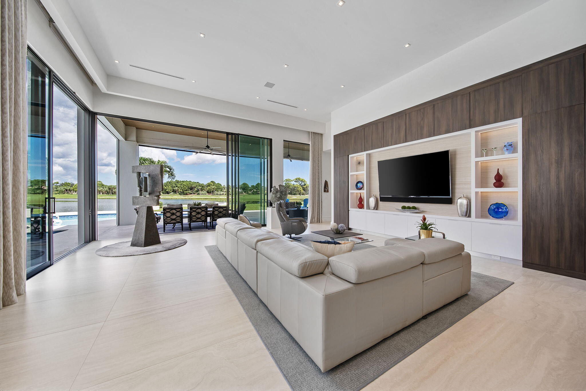 208 Locha Drive Jupiter, FL 33458 - Photo 25 of 125 a living room with furniture and a flat screen tv