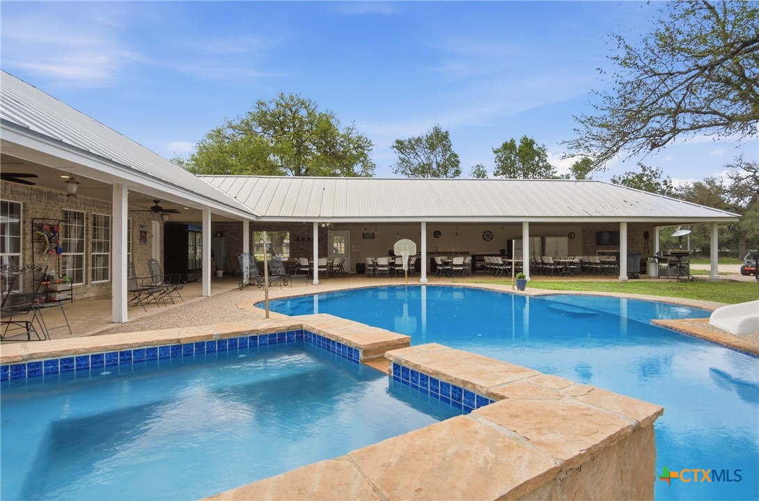 642 Phantom Rider Trail Spring Branch, TX 78070 - Photo 1 of 41 a view of swimming pool with outdoor seating