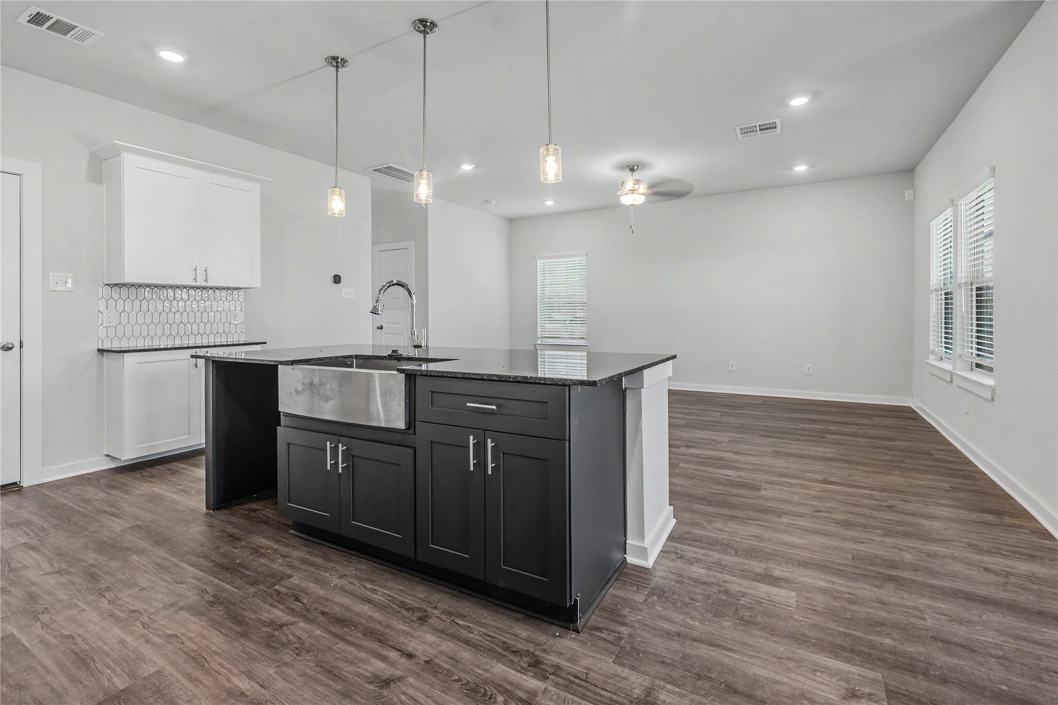6426 Bolinas Court Rosharon, TX 77583 - Photo 17 of 49 a kitchen with a sink a counter space and wooden floor