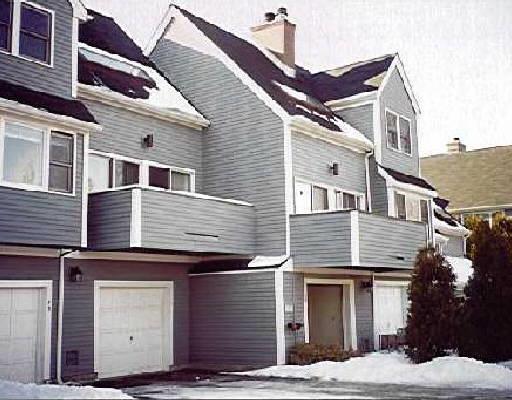73 Wilton Crest Road, Unit 73 Wilton, CT 06897 - Photo 1 of 1 a view of a building with a roof