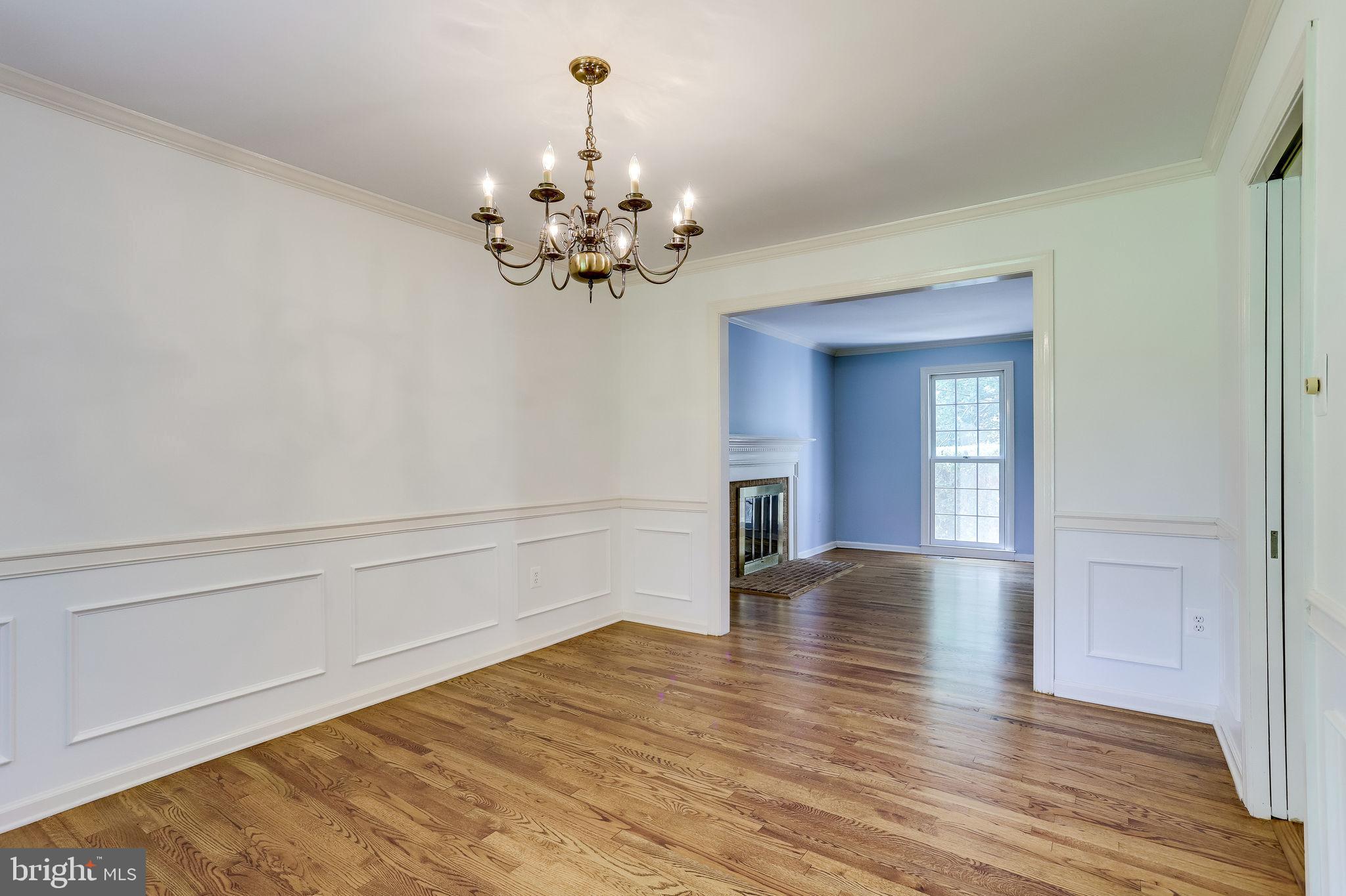 1009 Riva Ridge Drive Great Falls, VA 22066 - Photo 18 of 62 Formal Dining Room view to LR fireplace