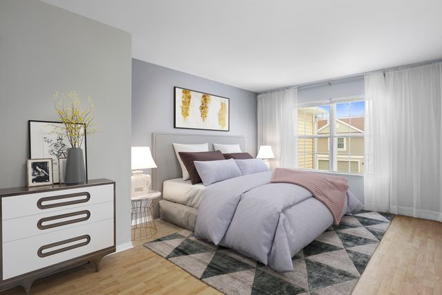 a bed room with a bed and a window