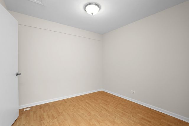 a bedroom with a bed and the wall painting