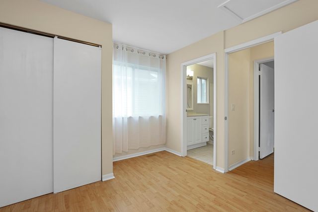 a bathroom with a granite countertop sink a toilet and a bathtub