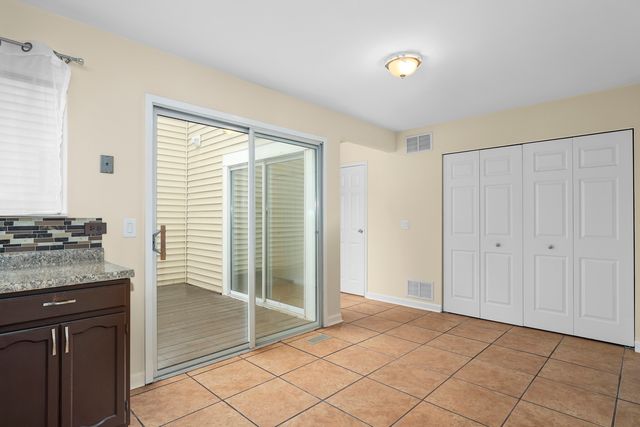 a view of a kitchen cabinets and wooden floor