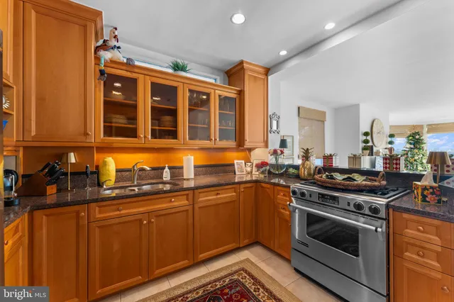 a kitchen with stainless steel appliances granite countertop a stove and a refrigerator