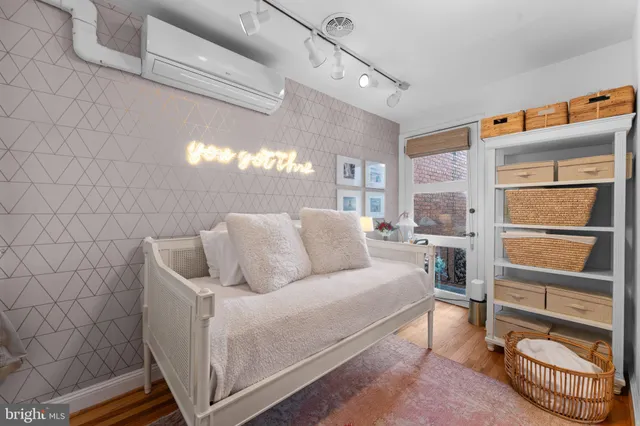 a view of a dining room with a table and chairs