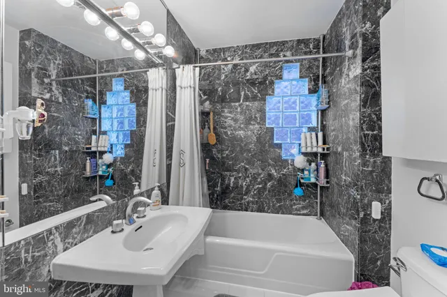 a bathroom with a sink double vanity and a mirror