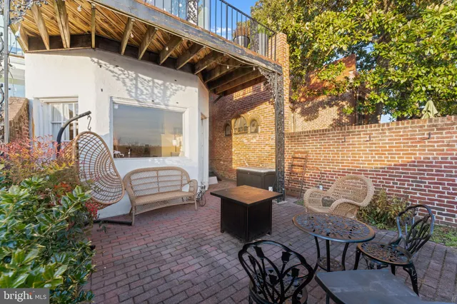 a bathroom with a sink vanity granite and shower