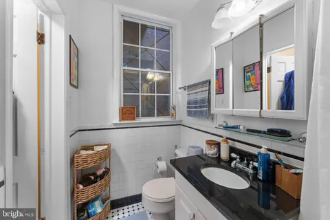 a kitchen with stainless steel appliances kitchen island granite countertop a stove a sink and a microwave