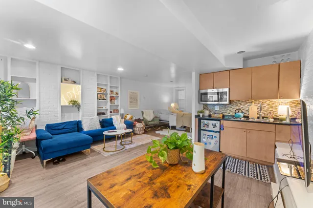 a bed room with a bed and a chair