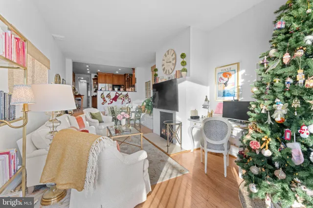 a living room with furniture and a book shelf