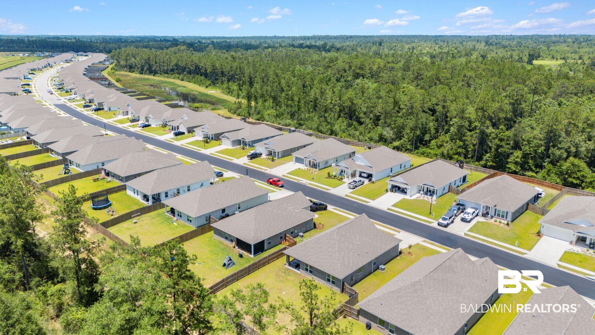 13966 Antler Hl Road Daphne, AL 36527 - Photo 41 of 44 Expansive residential development featuring multiple single-story homes with neutral exteriors and dark roofing