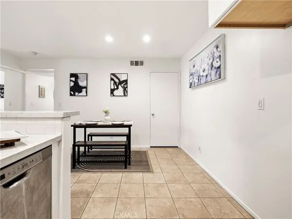 a view of room with cabinets and wooden floor
