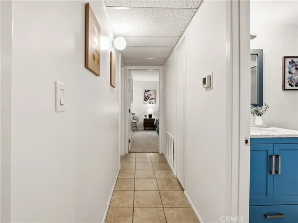 a view of a hallway with a room