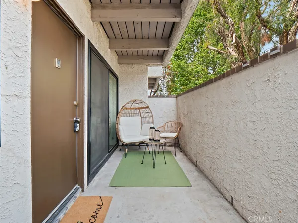 a view of backyard with a patio and a yard