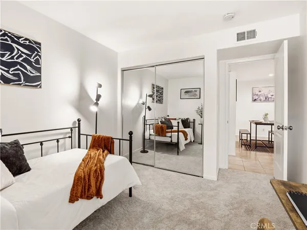 a bed room with a bed and a couch