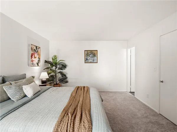 a bed room with a bed and a couch