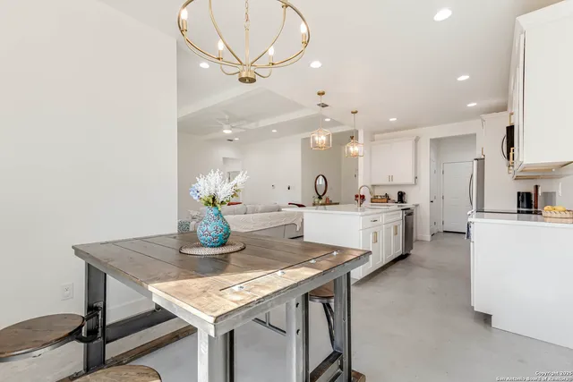 a bedroom with a bed flat screen tv and window