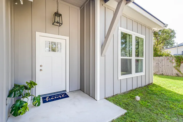 a view of backyard with a garden and plants