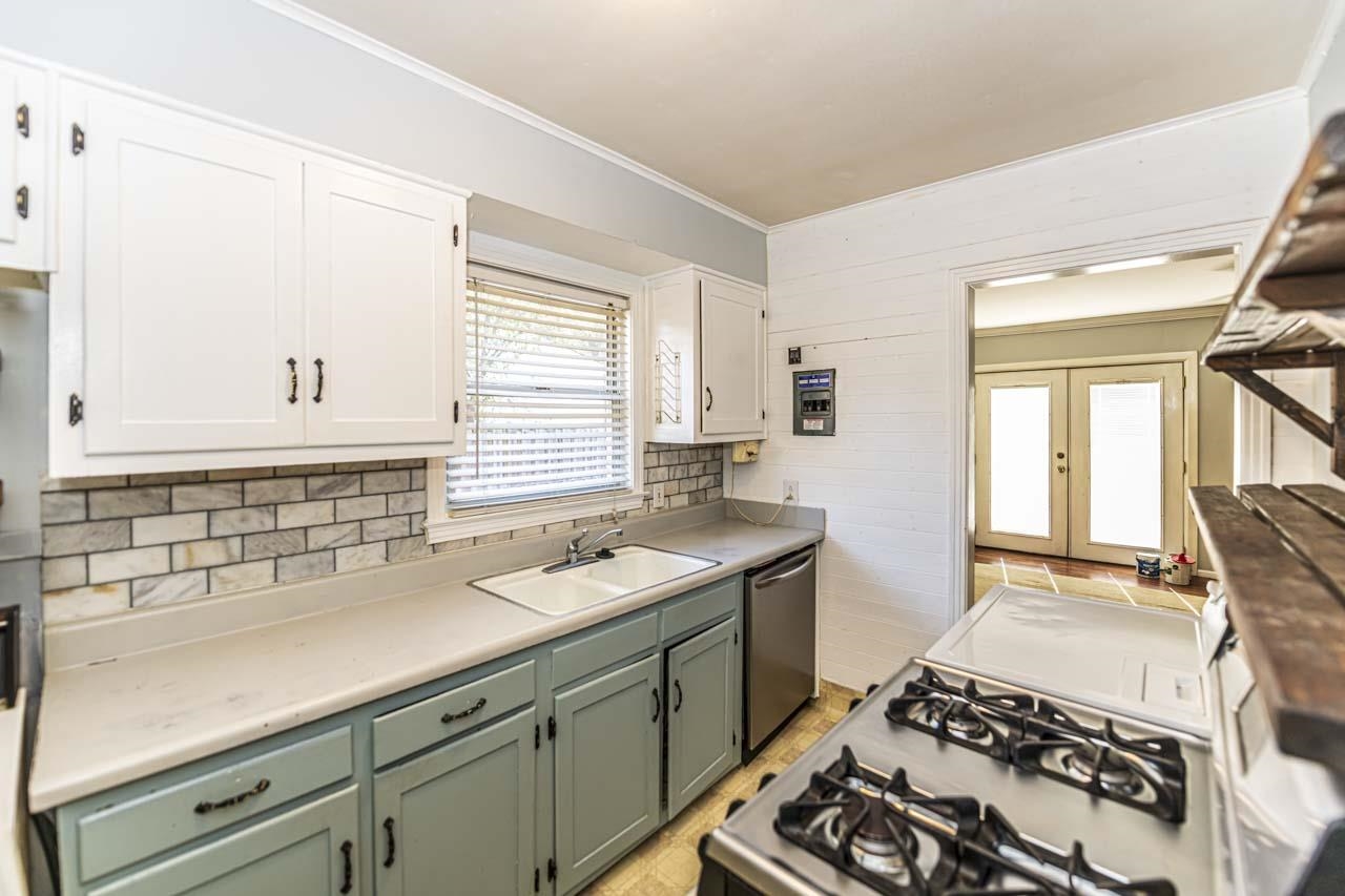 4329 Macon Road Memphis, TN 38122 - Photo 8 of 25 a kitchen with a sink stove and cabinets
