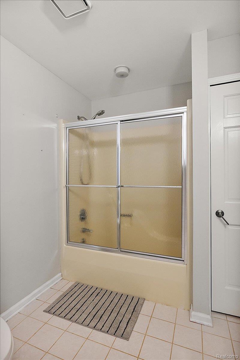 707 West Sutton Road Metamora, MI 48455 - Photo 61 of 84 Tub and shower combination with sliding glass enclosure
