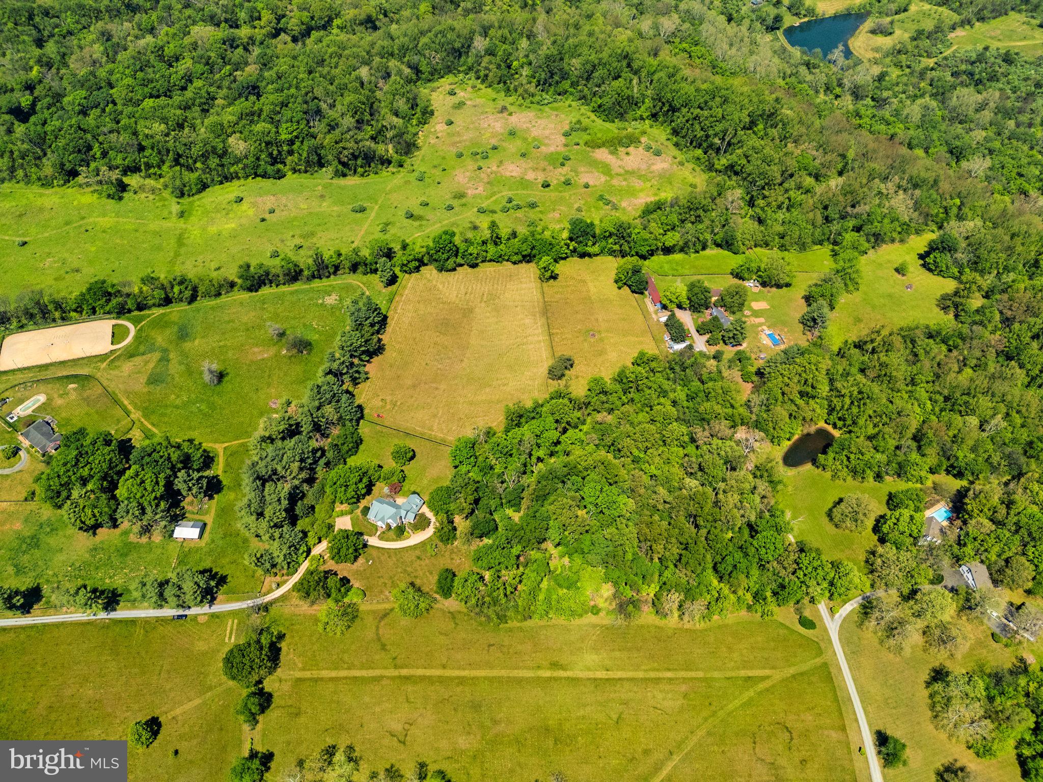 36190 Turkey Roost Road Middleburg, VA 20117 - Photo 84 of 88 a view of a lake with a yard