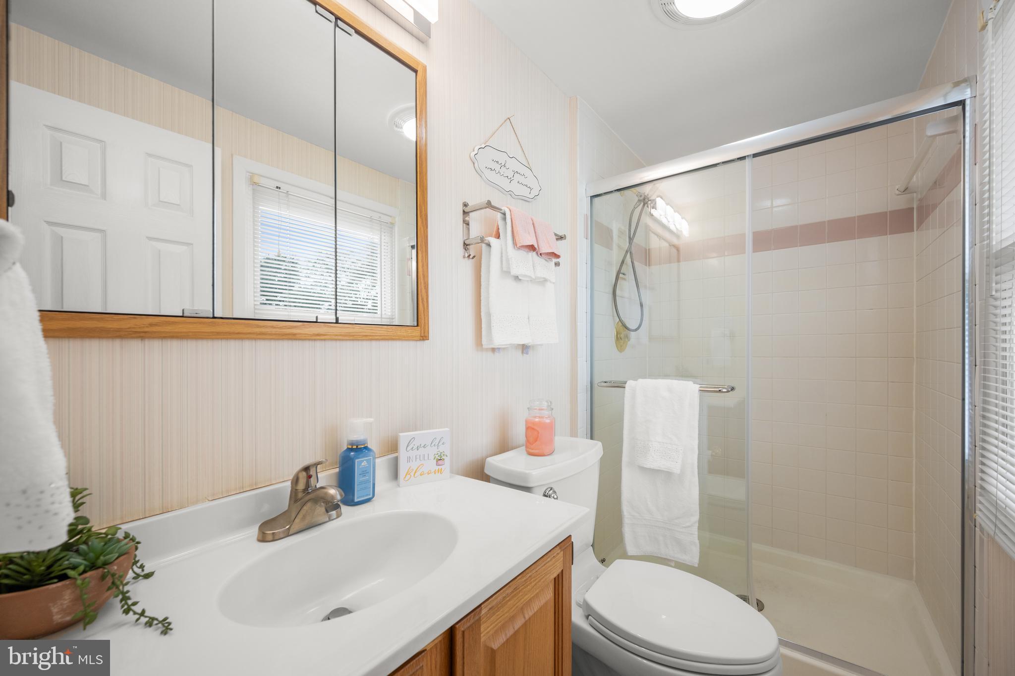 3402 Morlock Lane Bowie, MD 20715 - Photo 12 of 21 a bathroom with a sink toilet vanity and shower