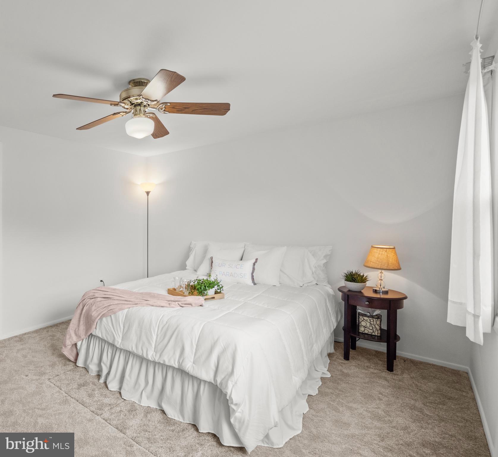 3402 Morlock Lane Bowie, MD 20715 - Photo 13 of 21 a bedroom with a bed and a chandelier
