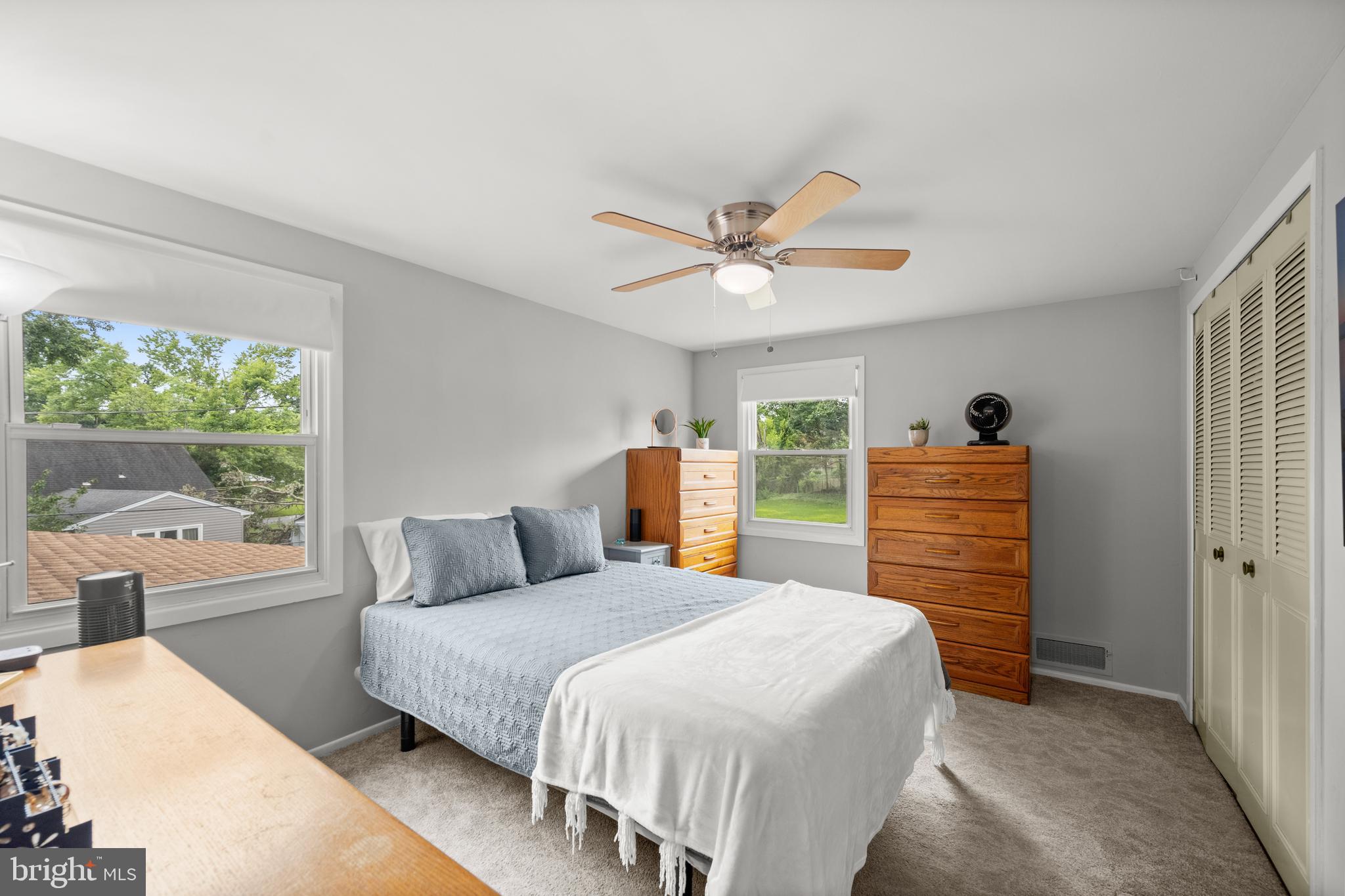 3402 Morlock Lane Bowie, MD 20715 - Photo 15 of 21 a bedroom with a large bed and a chandelier