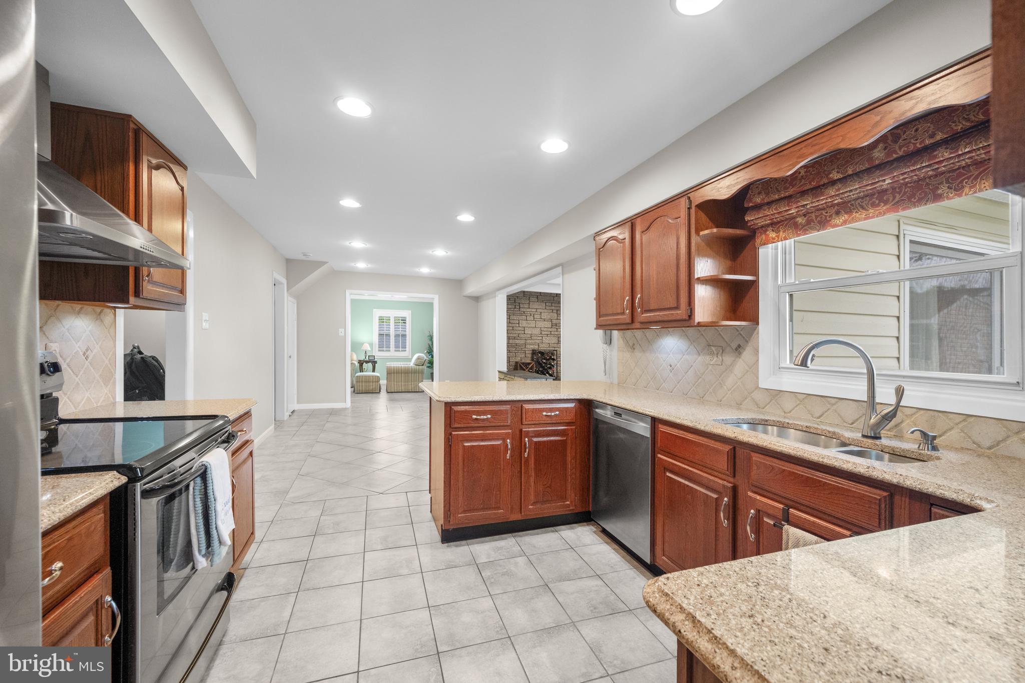 3402 Morlock Lane Bowie, MD 20715 - Photo 5 of 21 a kitchen with stainless steel appliances granite countertop a sink stove and cabinets
