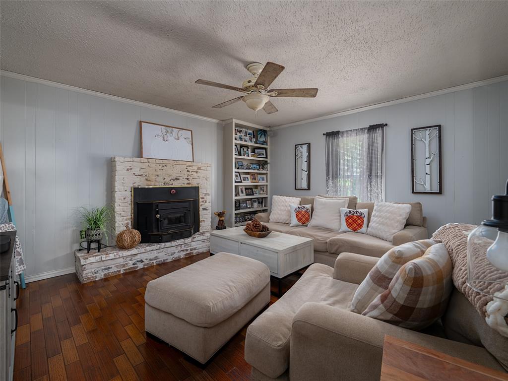 808 Walters Frankston, TX 75763 - Photo 12 of 32 a living room with furniture a fireplace and a large window