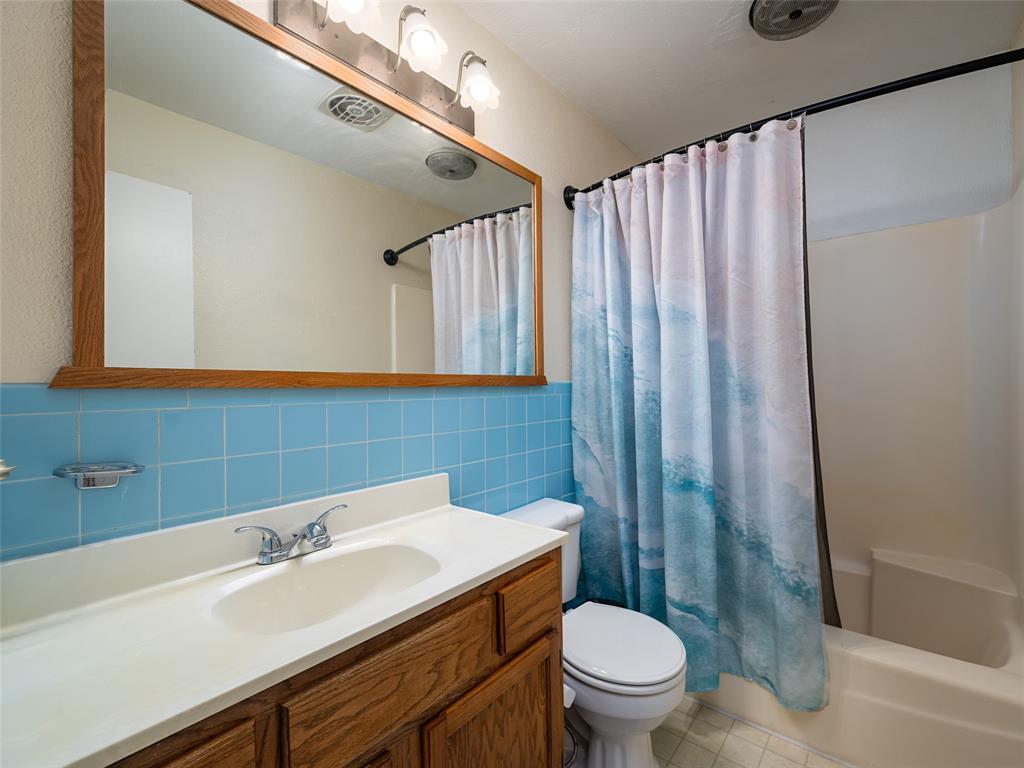 808 Walters Frankston, TX 75763 - Photo 17 of 32 a bathroom with a sink a toilet and shower