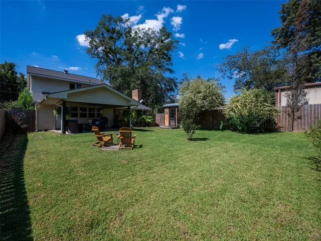 a view of a backyard with a garden